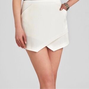 BCBG mini skirt size small asymmetrical in excellent like-new condition